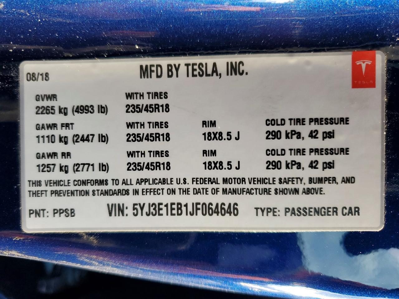 Tesla VIN label with the full 17-character VIN
